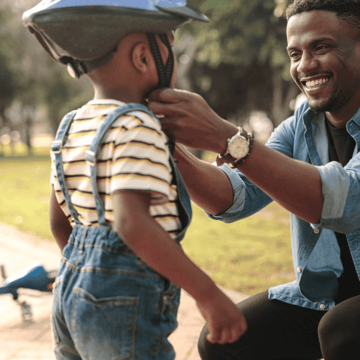 XYPN Father and son learning to ride a bike